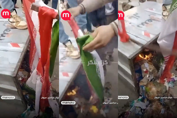 Etirazçılar İran bayrağını zibil qutusuna atıb yandırdılar 